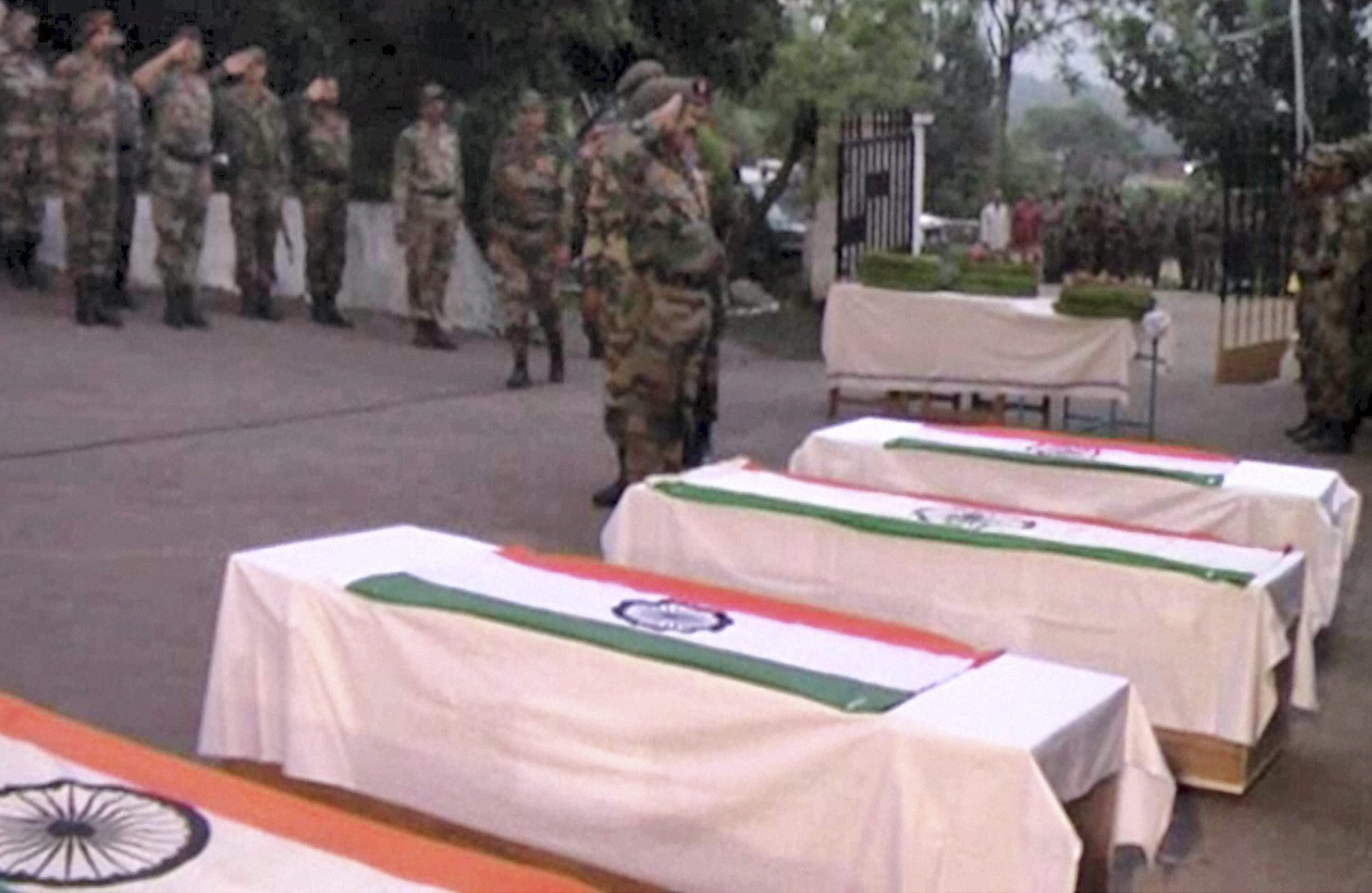 Army soldiers pay tributes to their slain colleagues at Poonch on Tuesday, August 7.